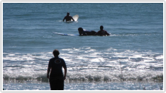 Great surfing at West End, Ohope Beach, New Zealand